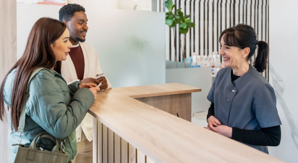 dental reception man woman clinical excellence